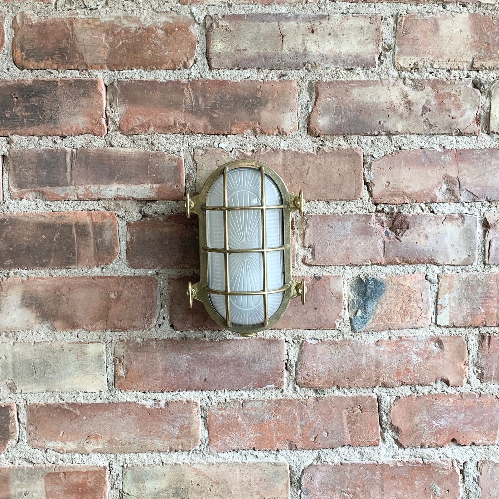 Contemporary Polished Brass Oval Bulk Head Wall Light
