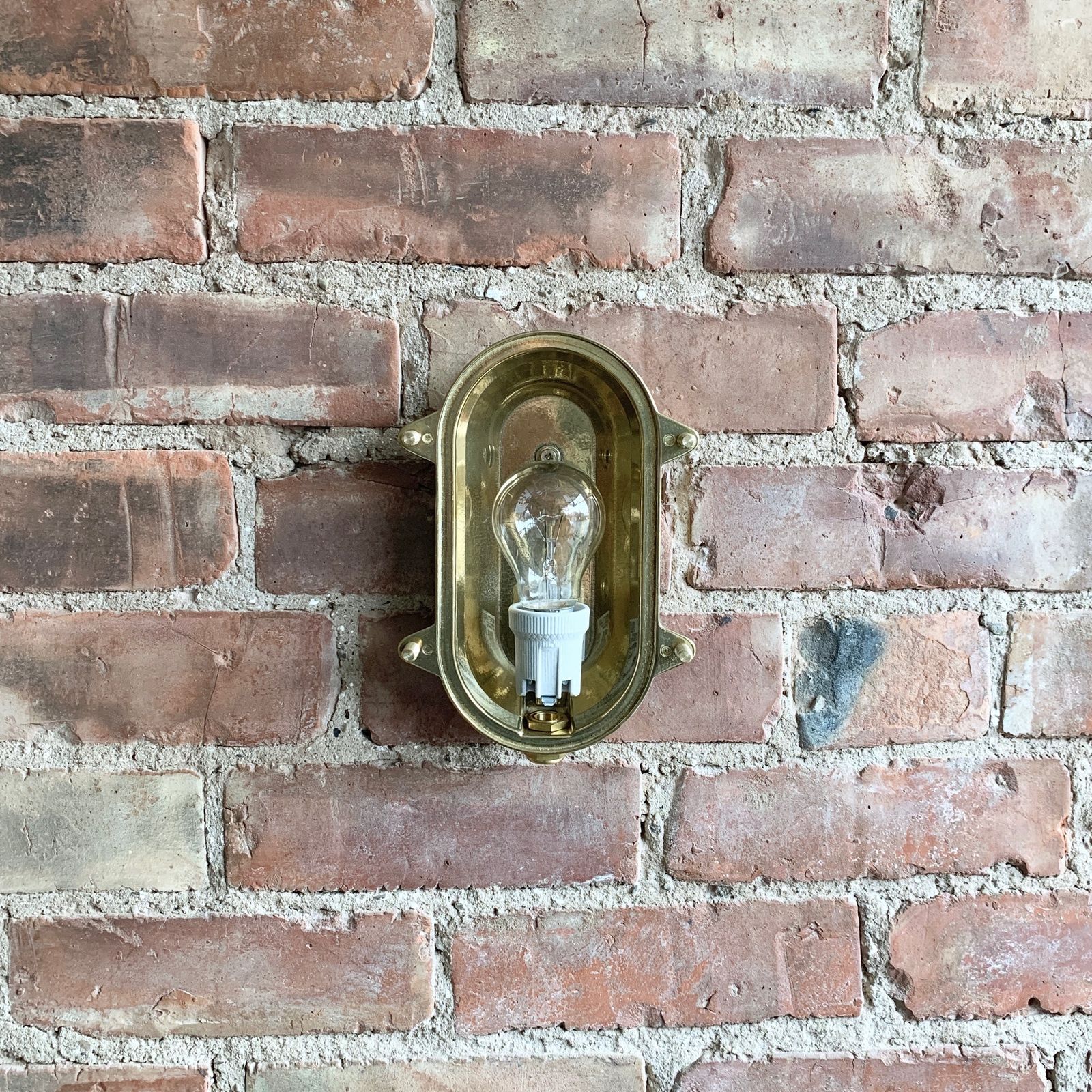 Contemporary Polished Brass Oval Bulk Head Wall Light photo vinterior