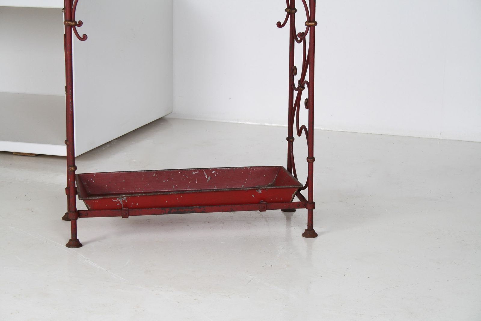 photo vintage Decorative French Parisian Chic Antique Wrought Iron Red Painted Umbrella Stick Stand