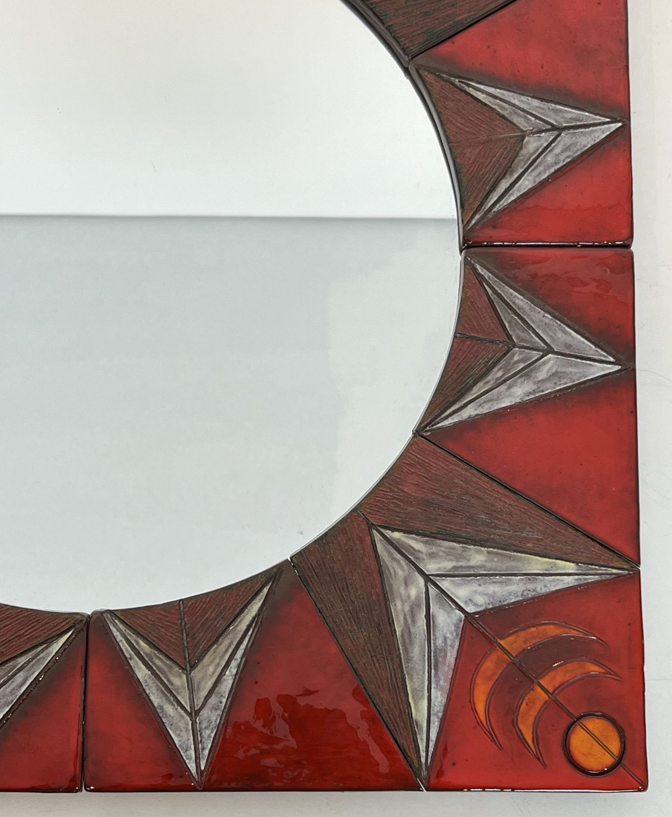 photo for sale Ceramic Mirror Depicting A Stylized Sun On A Red Background Attributed To Oswald Tiberghien