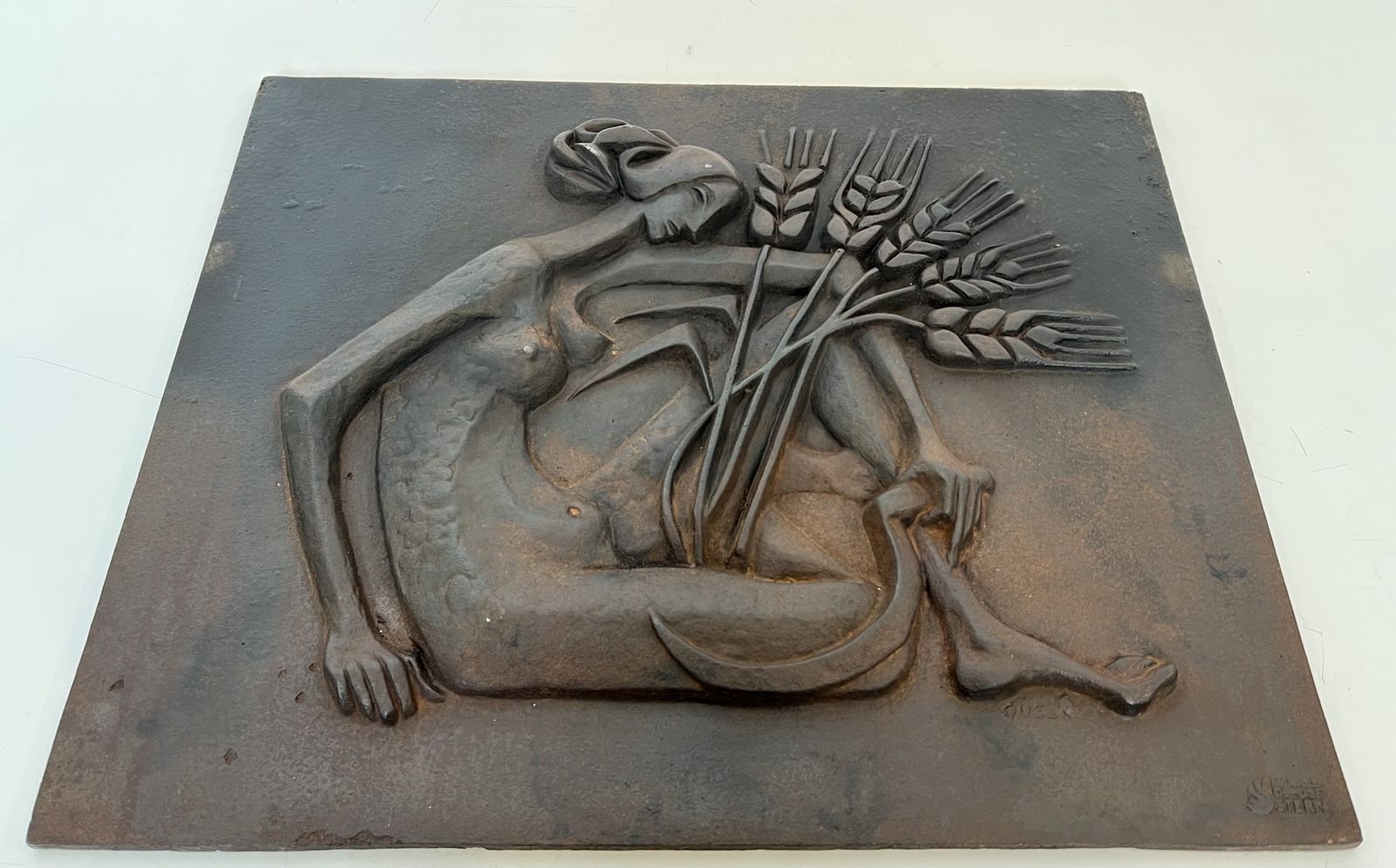 1250.0 Modernist Cast Iron Fireplace Plate Depicting A Nude Woman Holding A Scythe And Ears Of Wheat photo