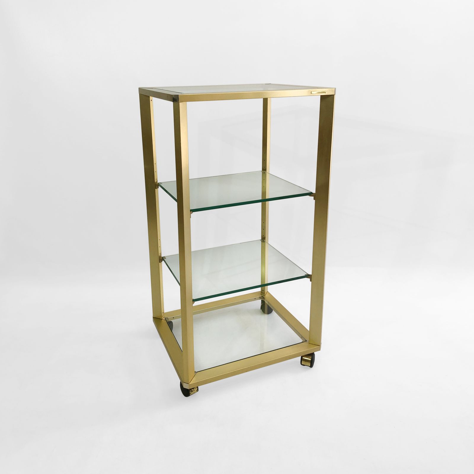 photo furniture Pierre Vandel Gold Glass Etagere On Wheels 1970s Mid Century Hollywood Regency Shelving Trolley Drinks Cart