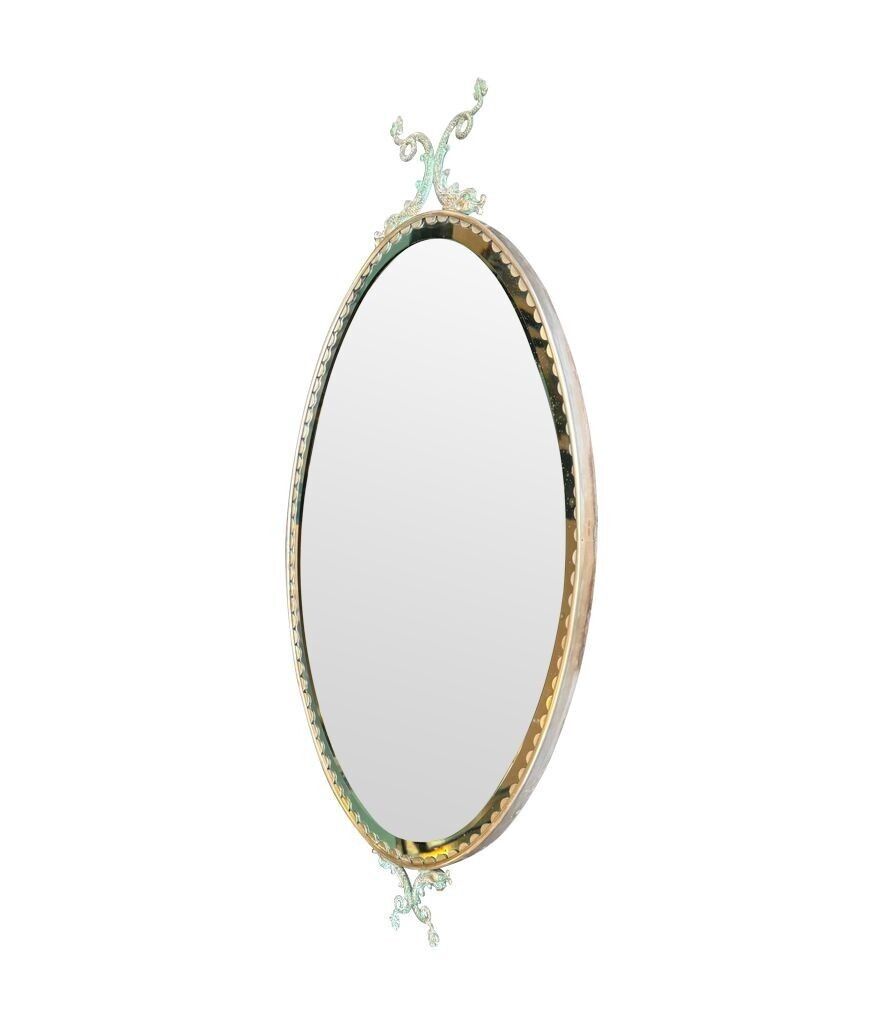 photo vinterior A Pair Of Italian 1940s Oval Mirrors With Dolphin Detailing Around The Brass Frame