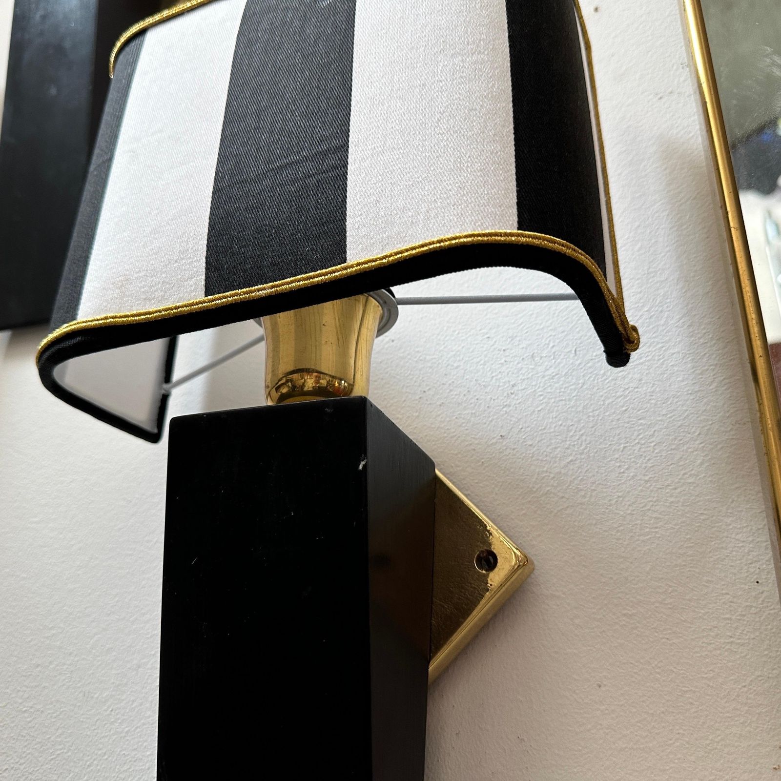 An Elegant 1980s Art Deco Style Black Painted Wood And Brass Italian Wall Sconce photo vintage