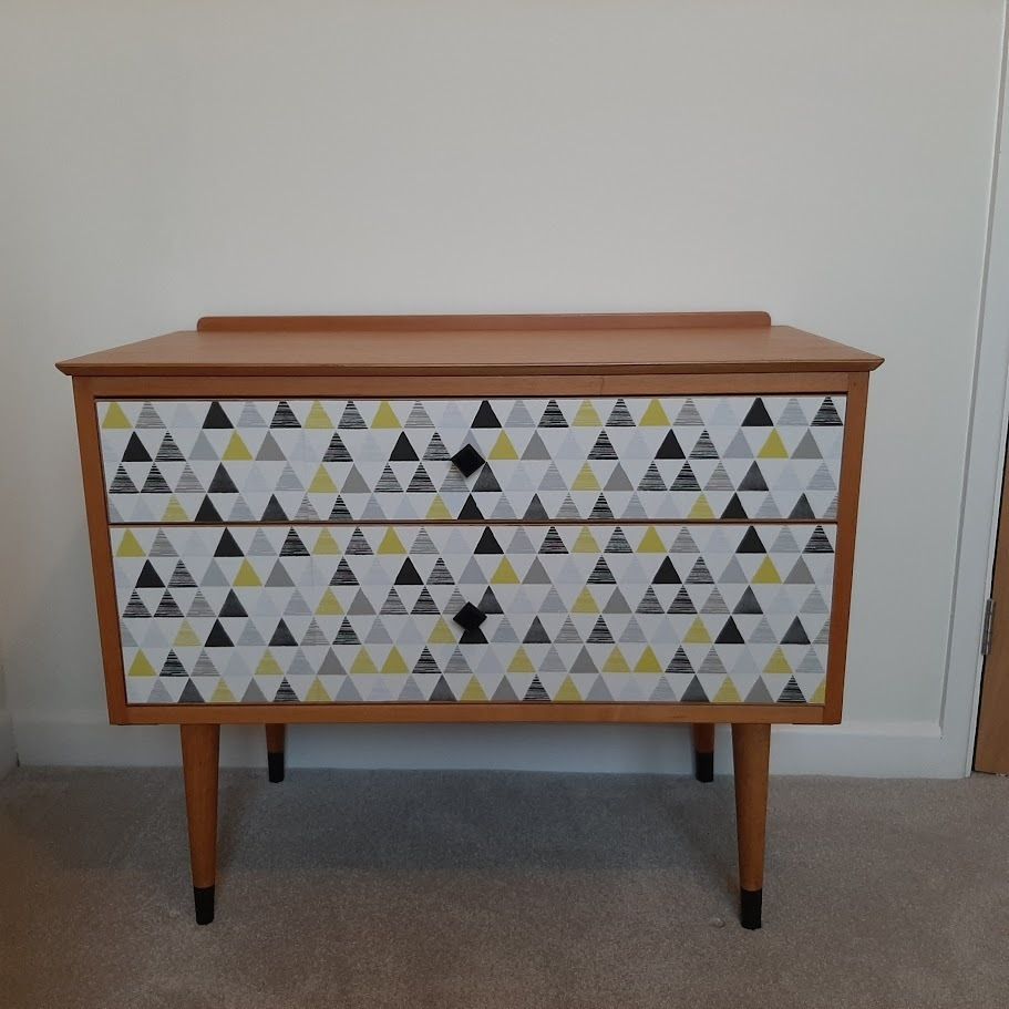 Mid Century Chest Of Drawers With Tapered Legs And Added Geometric Design. photo for sale