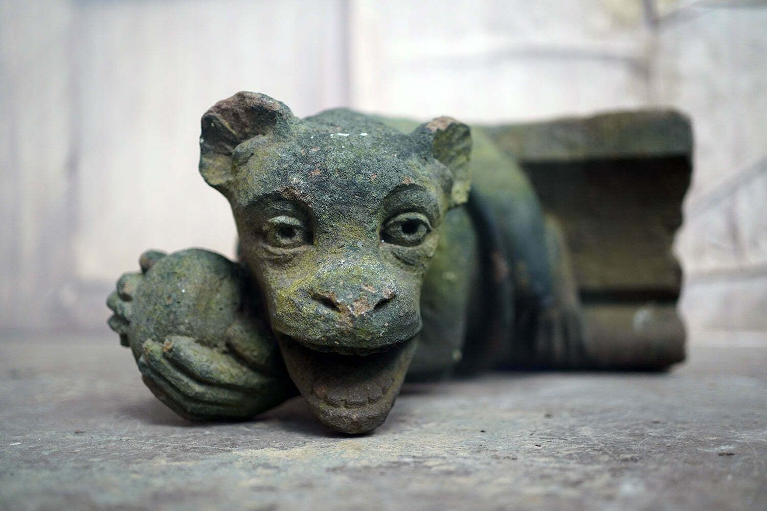 A Rare Medieval Period Carved Stone Grotesque Holding A Coconut C.1300 1400 photo for sale