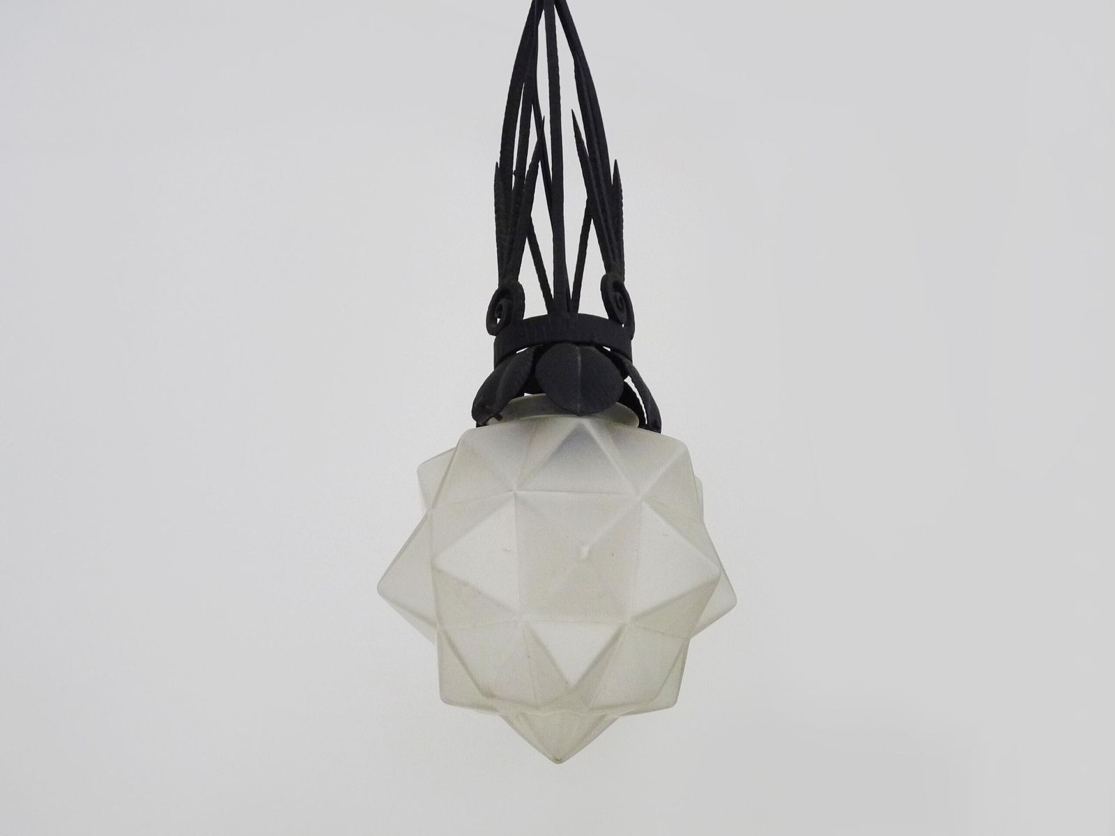 Chandelier, Art Deco Pendant Light In Wrought Iron And Star Globe In Glass Paste. 1930s photo for sale