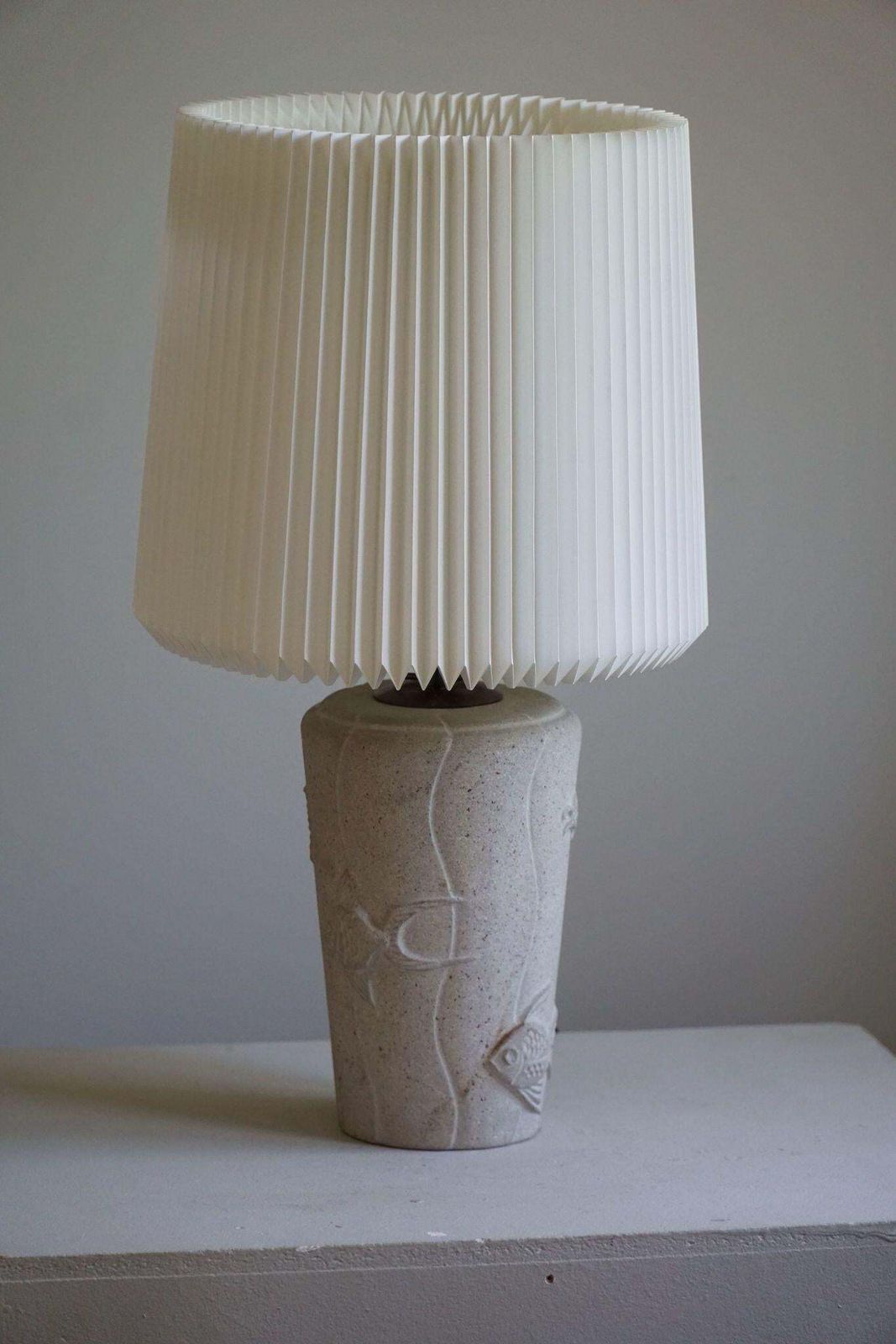 French Modern, A Vintage Table Lamp In Stone With Fish Motifs, 1970s photo buy