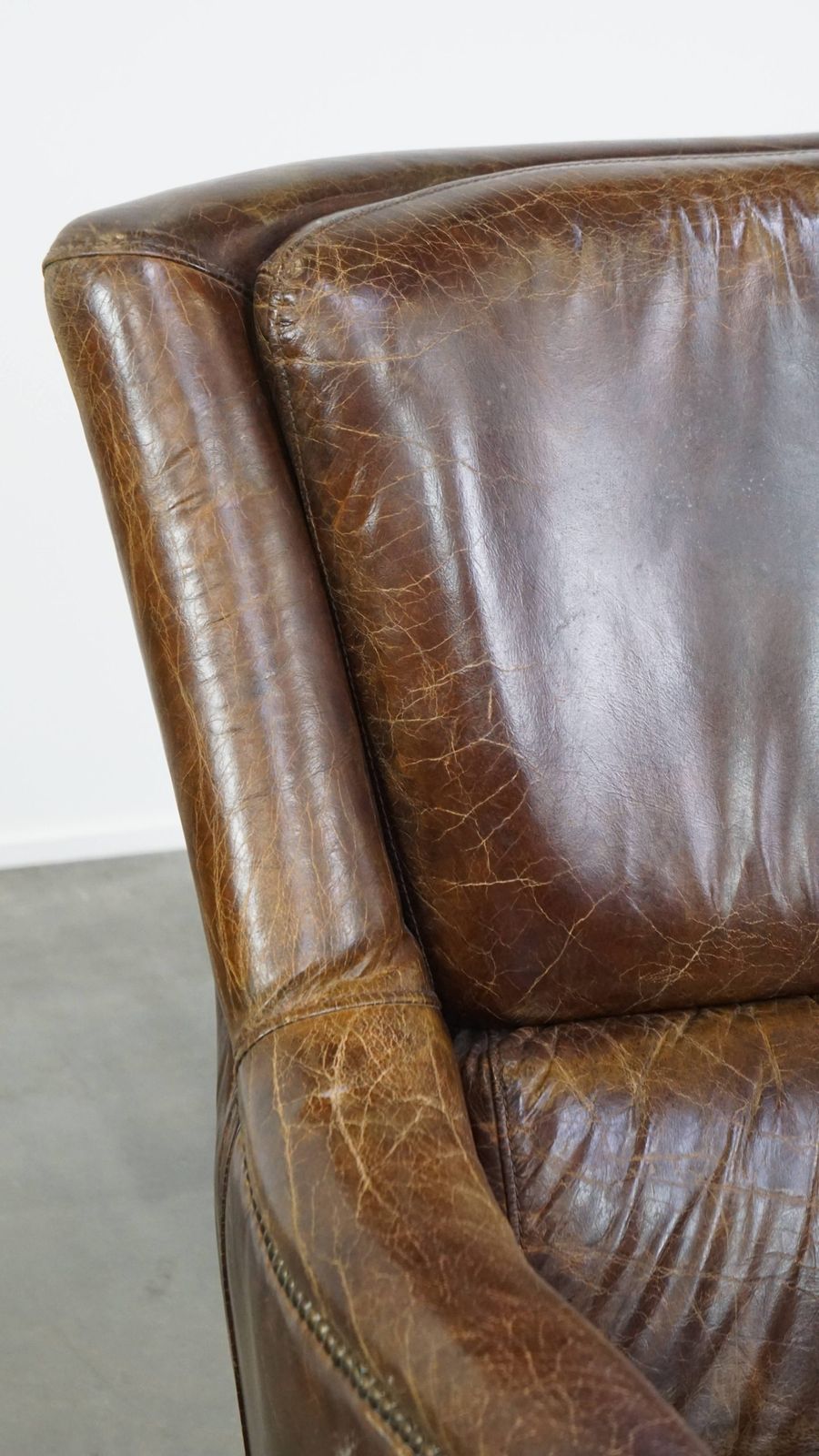 photo for sale Stately And Comfortable Cowhide Armchair With A Timeless Design And A Beautiful Color Scheme