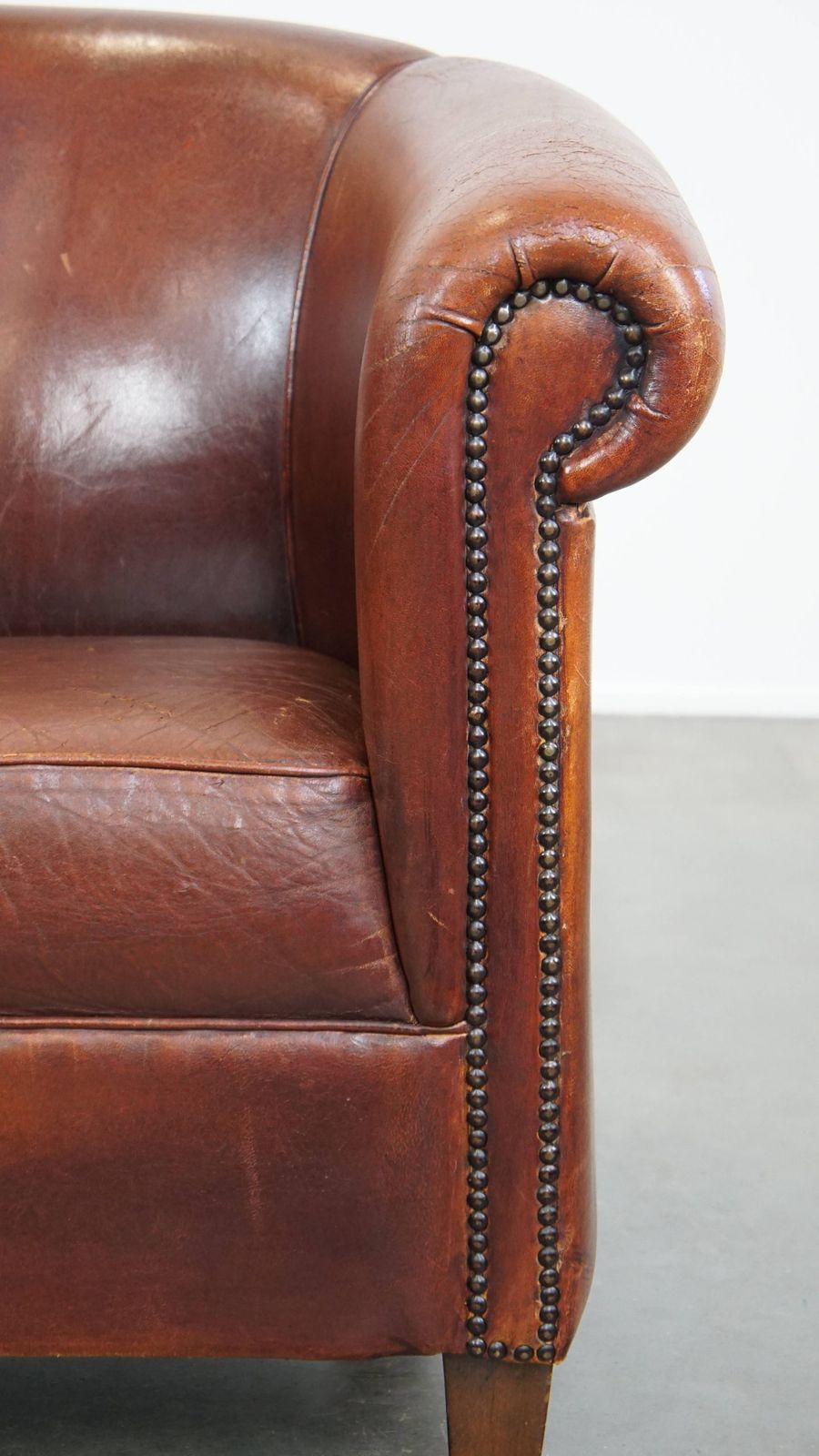 photo furniture Comfortable Vintage Sheepskin Club Chair In English Style With A Beautiful Patina