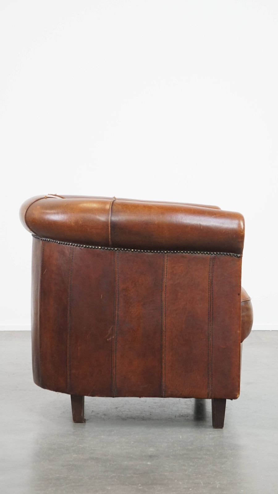 Sheepskin Club Chair In A Charming Cognac Colour And Finished With Piping On The Backrest photo for sale