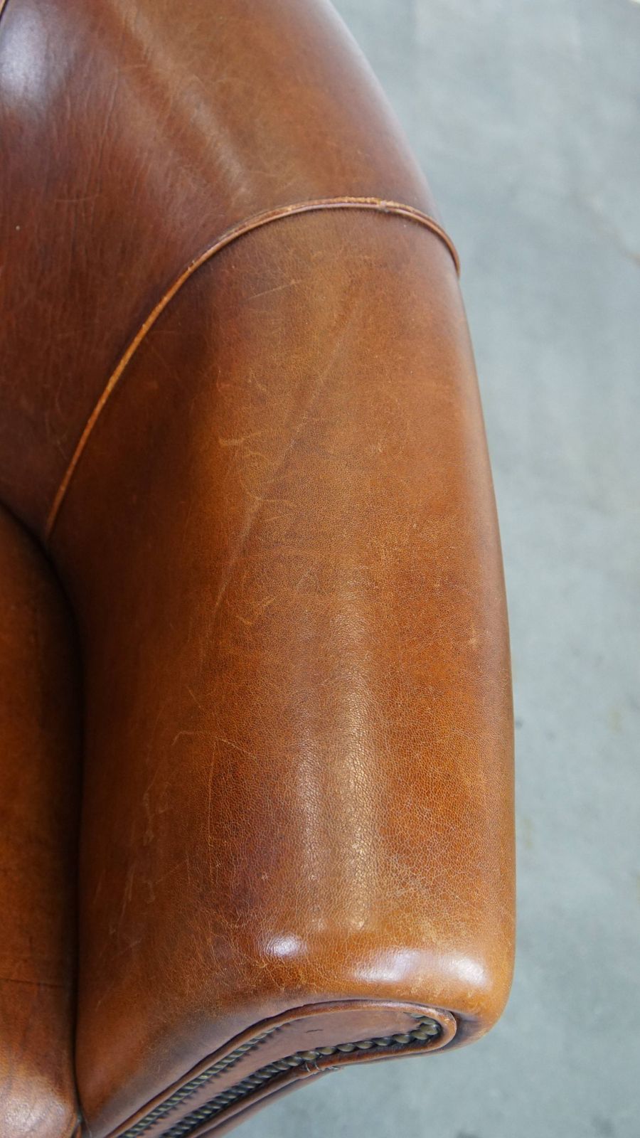 Sheepskin Club Chair In A Charming Cognac Colour And Finished With Piping On The Backrest photo vintage