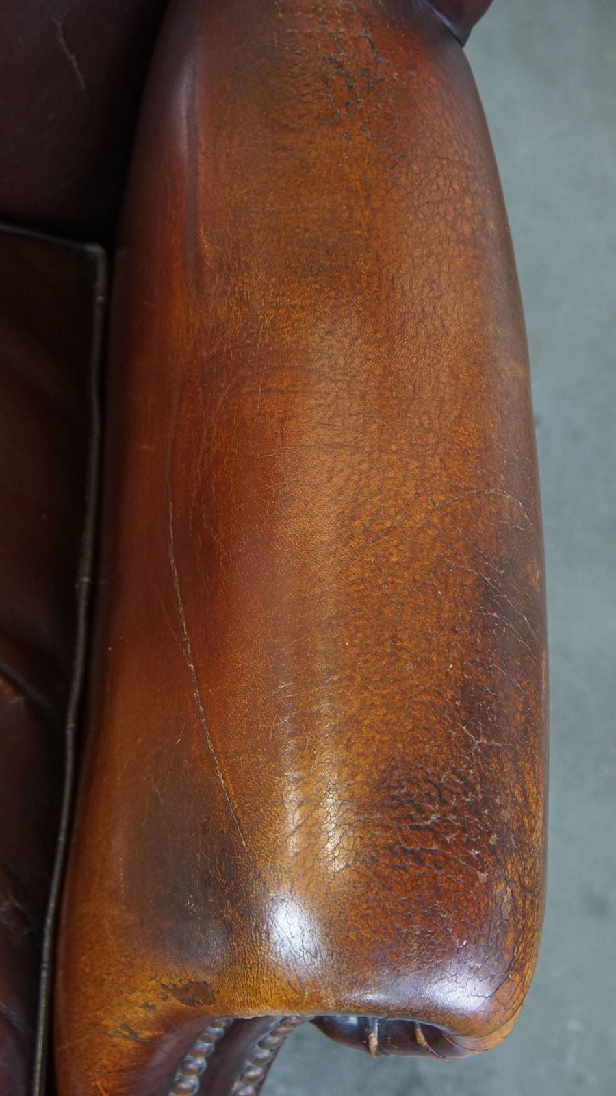 Classic, Luxurious And Comfortable Dark English Style Sheepskin Wing Chair With Lots Of Character And A Beautiful Patina photo vintage
