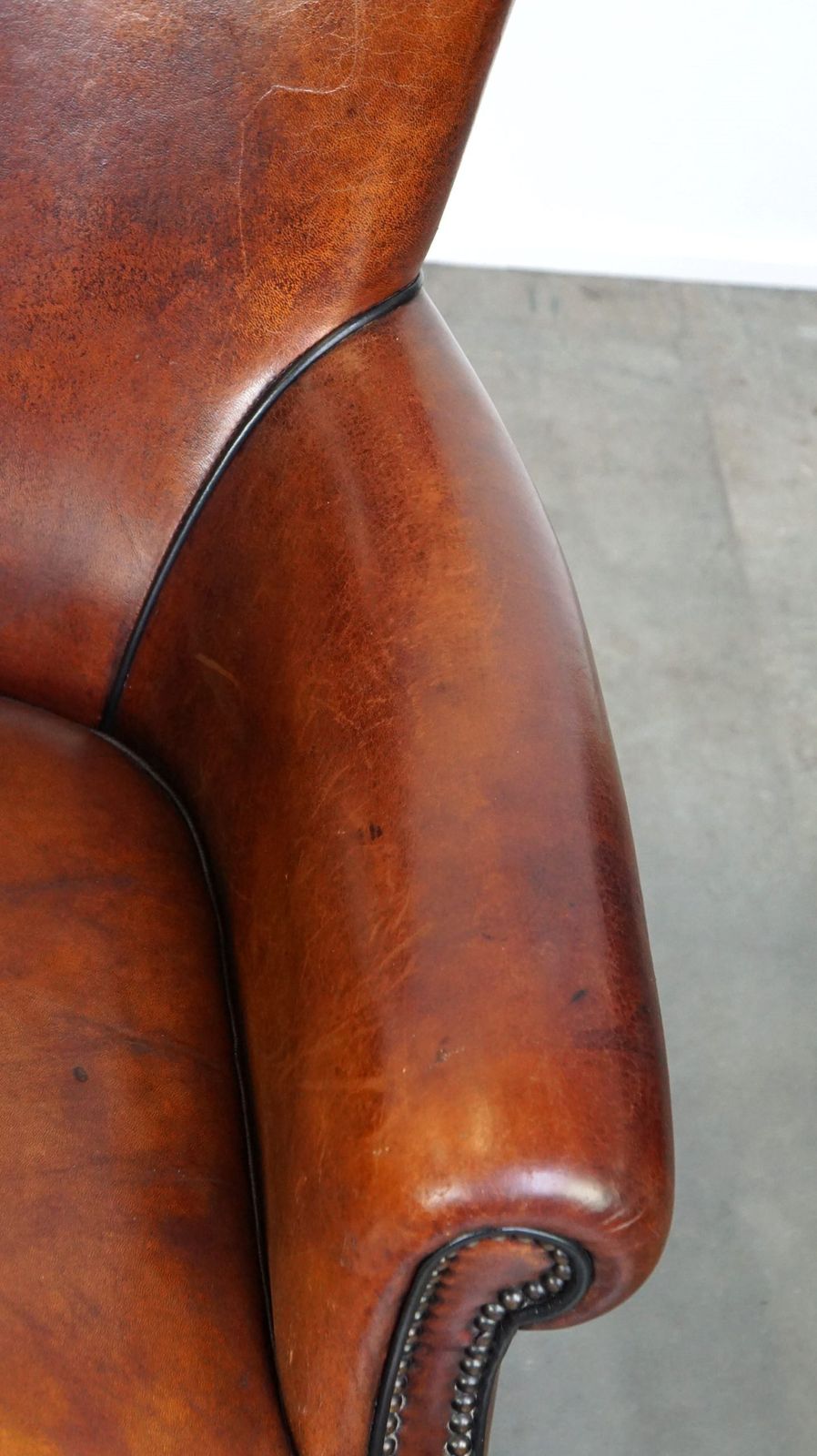 Comfortable Sheepskin Armchair With A Beautiful Finish And Deep Color photo vintage