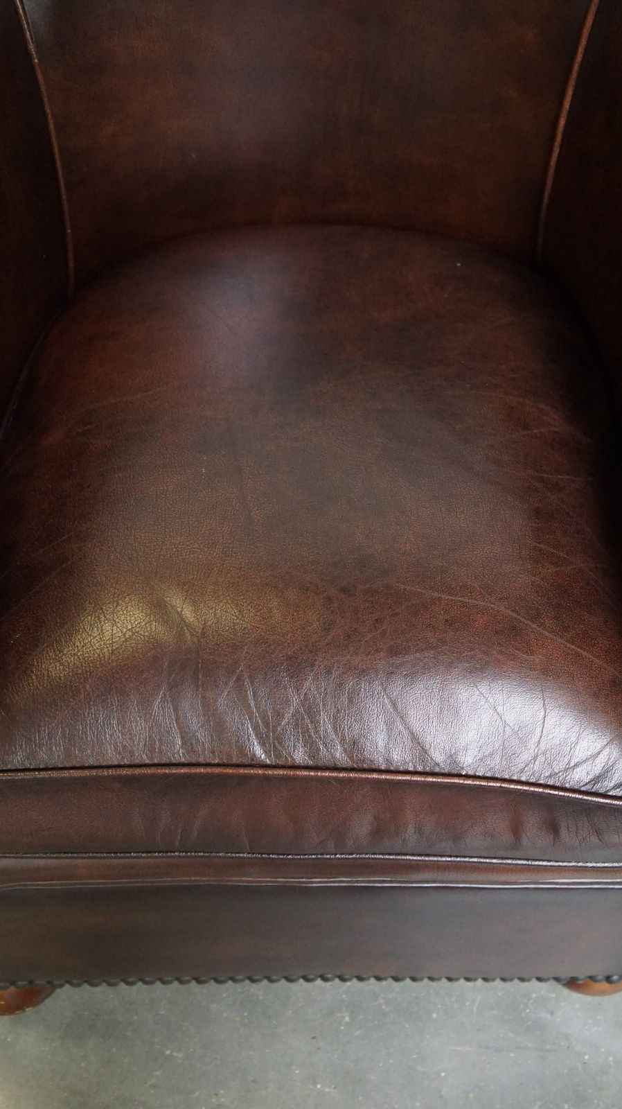 Beautiful Luxurious Dark Cowhide Club Chair With Ball Feet In English Style photo vinterior