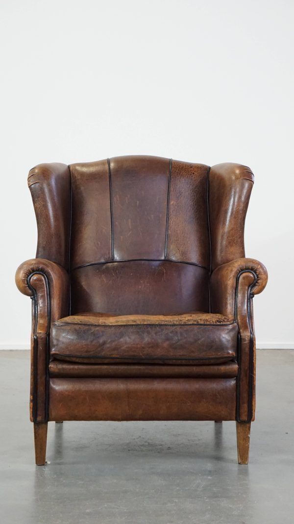 Characteristic And Comfortable Sheepskin Wing Chair With A Beautiful Patina photo furniture