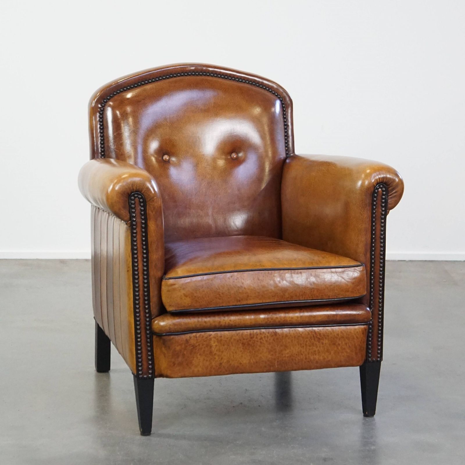 Well Maintained Sheepskin Leather Design Armchair, Luxuriously Finished With Decorative Nails And Black Piping photo furniture