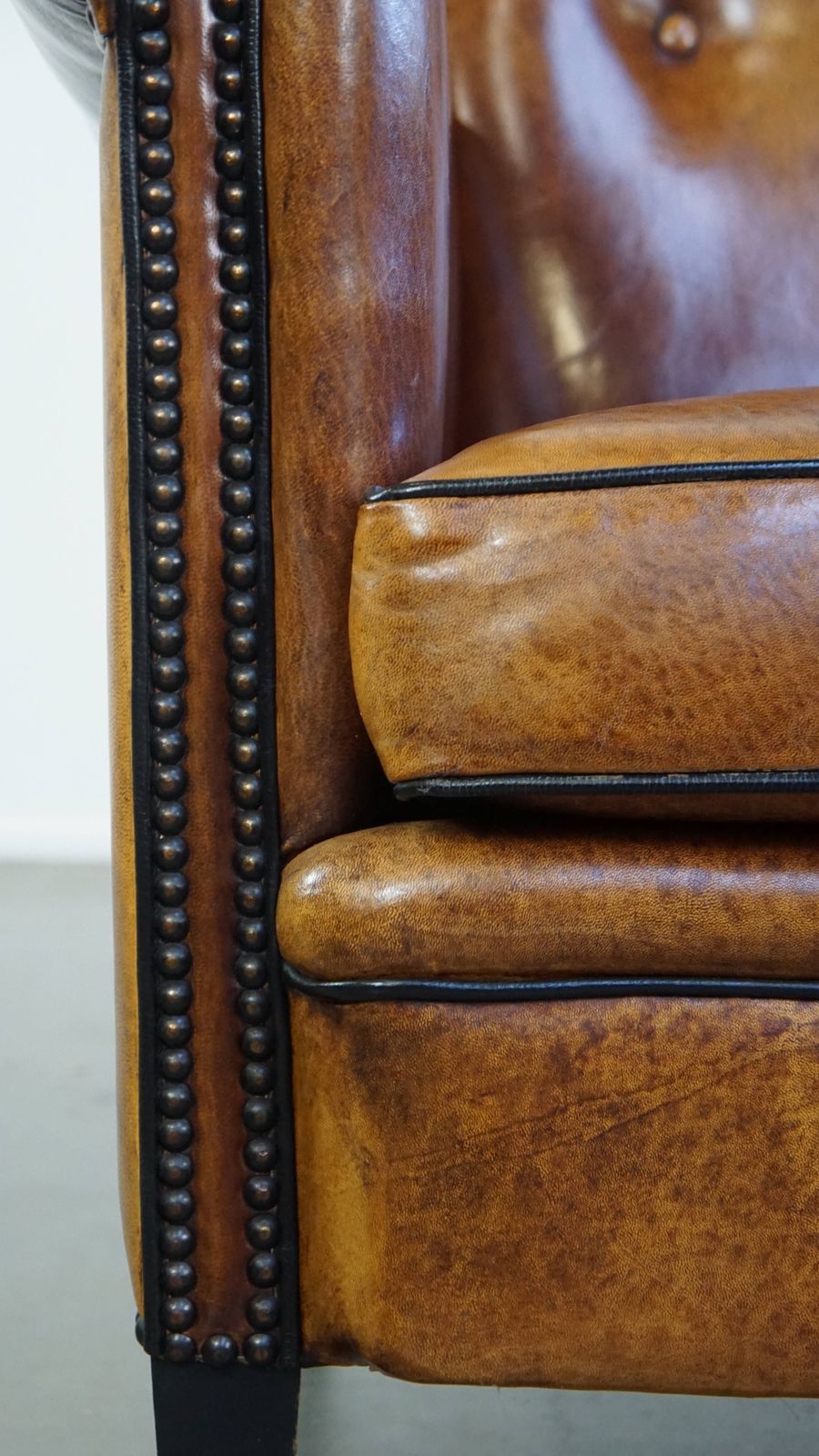 1566.4517999999998 Well Maintained Sheepskin Leather Design Armchair, Luxuriously Finished With Decorative Nails And Black Piping photo
