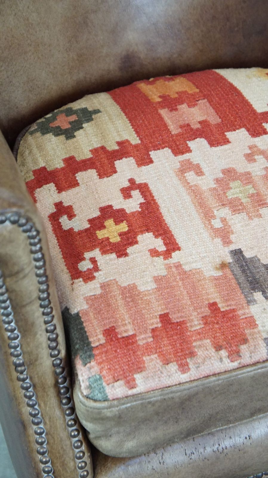 photo furniture Subtle Cowhide Armchair With A Reversible Kilim Seat Cushion