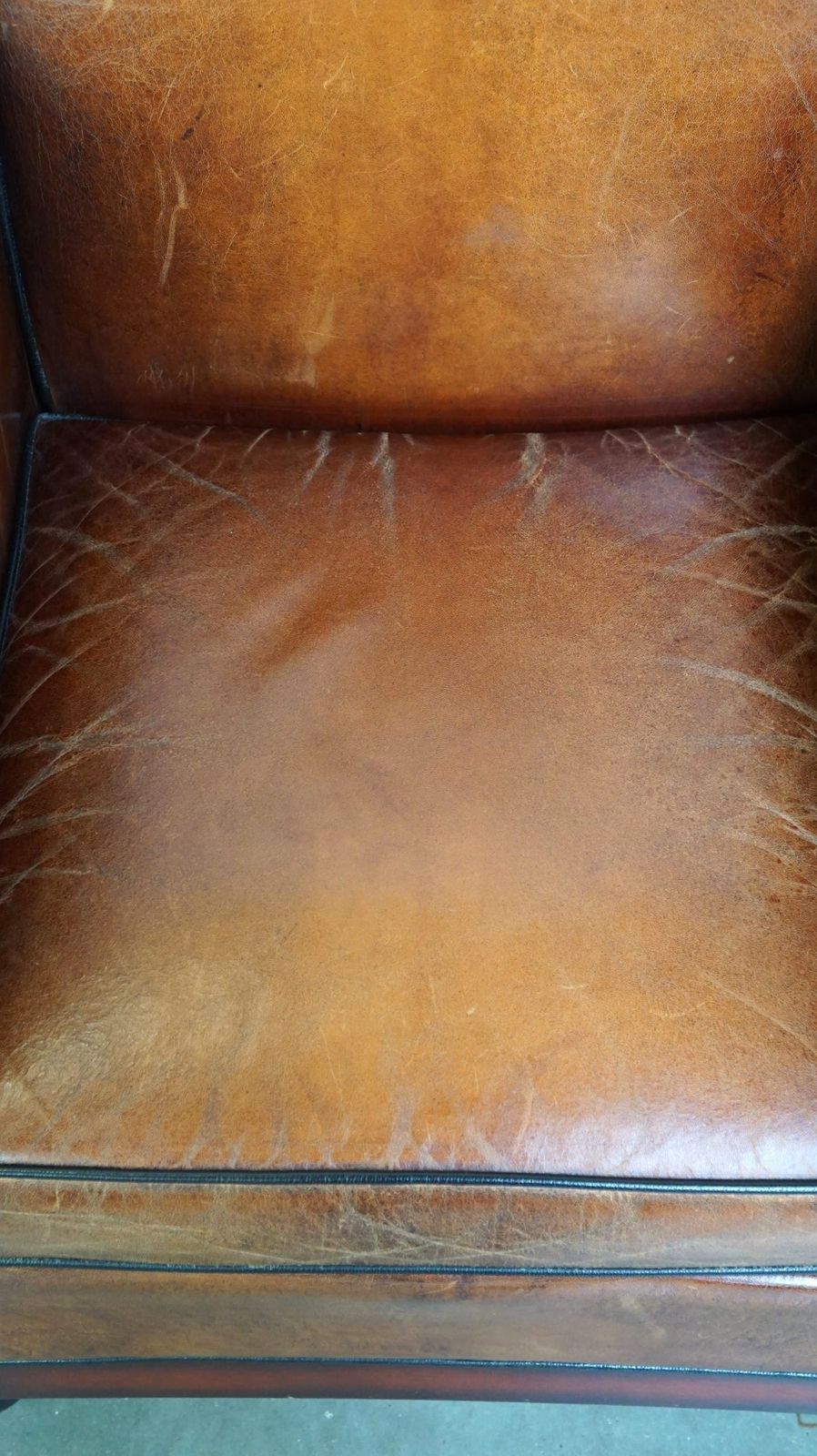 Sheepskin Art Deco Design Armchair Finished With Wood And Beautiful Cognac Colored Leather photo vinterior