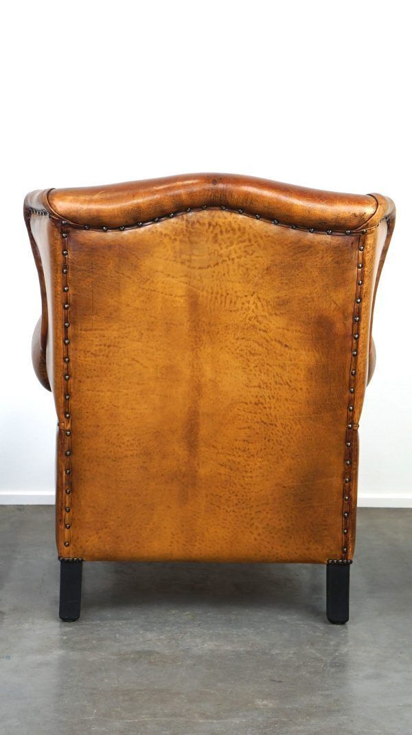 Beautiful Armchair Made Of Very Good Quality Sheepskin Finished With Nails And Black Piping photo vinterior