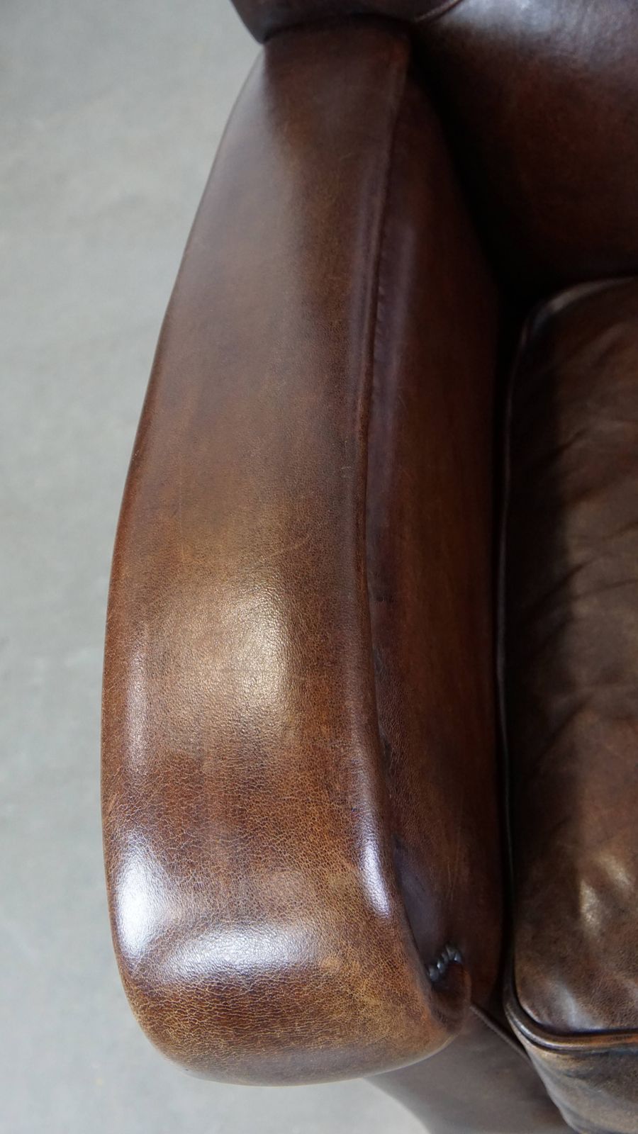Royal And In Good Condition Dark Sheepskin Armchair With Round Shapes And A Comfortable Seat photo buy