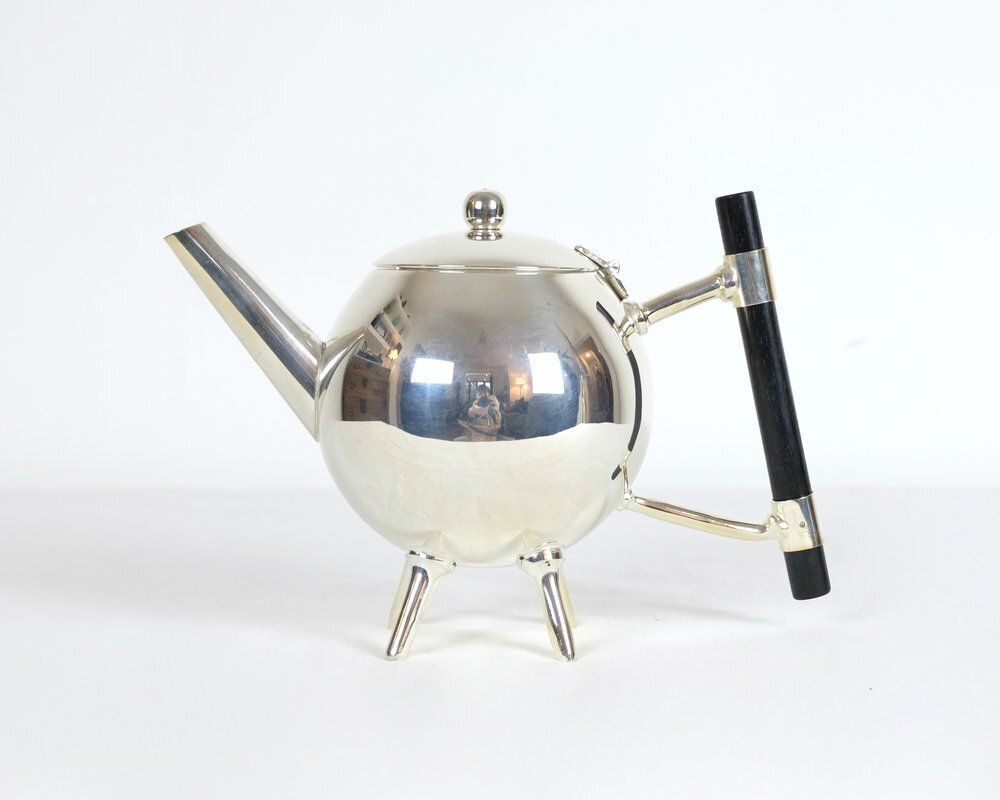 A Silver Art Deco Christopher Dresser Spherical Teapot