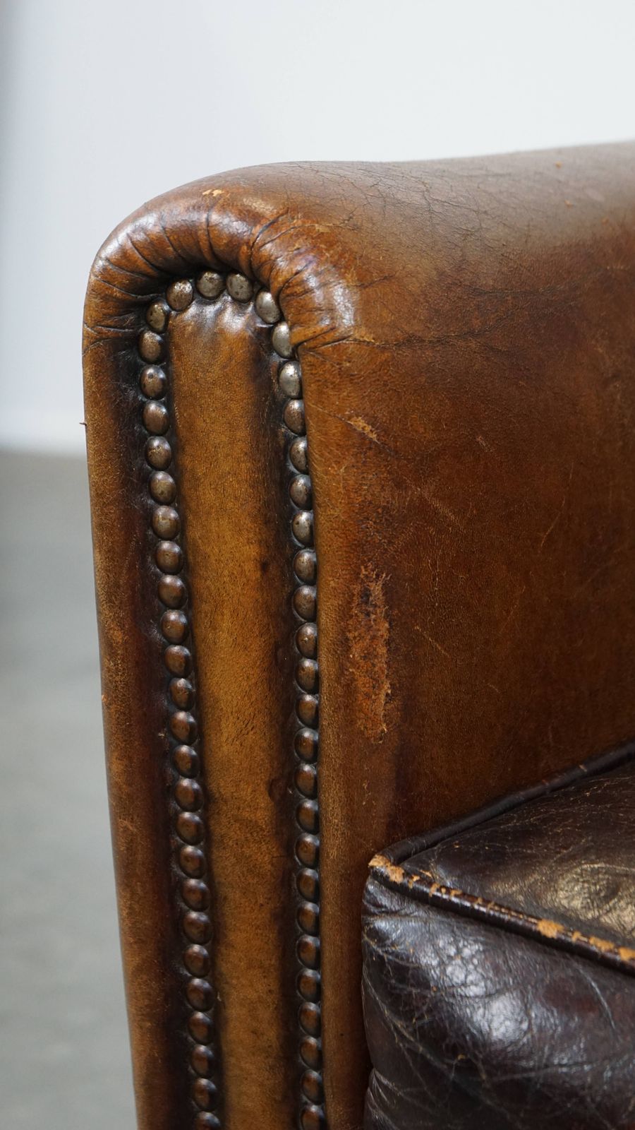 photo vinterior Charming And Characteristic Subtle Patinated Sheepskin Armchair With A Wonderful Patina