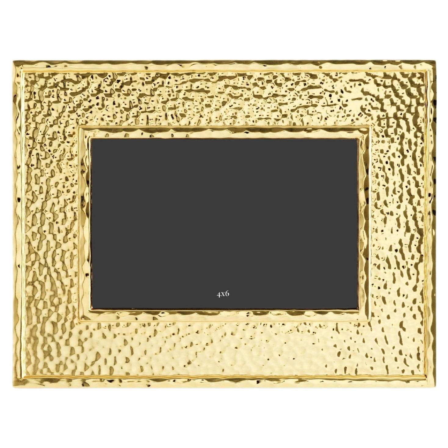 Small, Contemporary Photo Frames In Hammered And Gilded Metal.