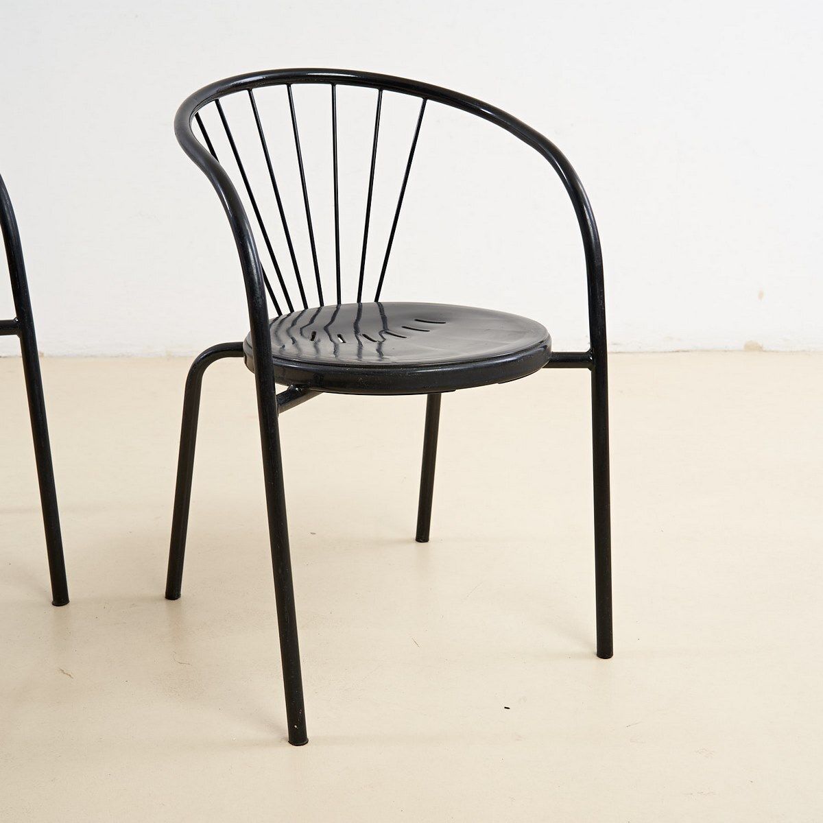 Pair Of Black Chairs In Sheet Metal And Metal Tube photo furniture