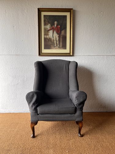 Large Comfortable Antique Wingback Chair With Clean Grey Coloured Loose Covers photo furniture