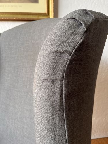Large Comfortable Antique Wingback Chair With Clean Grey Coloured Loose Covers photo for sale
