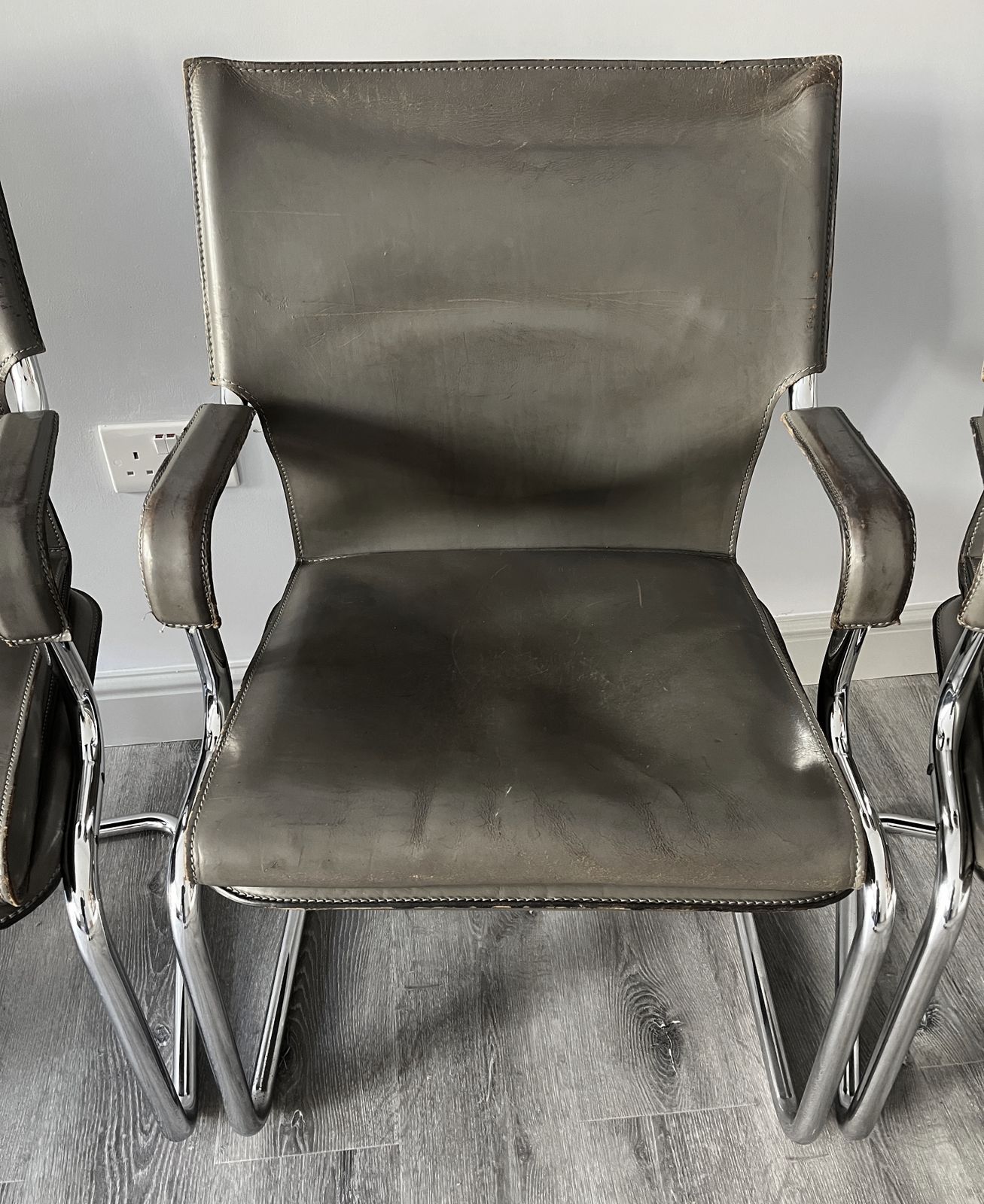 photo vinterior Set Of 6 Iconic Uno Chairs In Hand Stitched Heavy Grey Leather On Tubular Chrome Metal Cantilevered Frames.