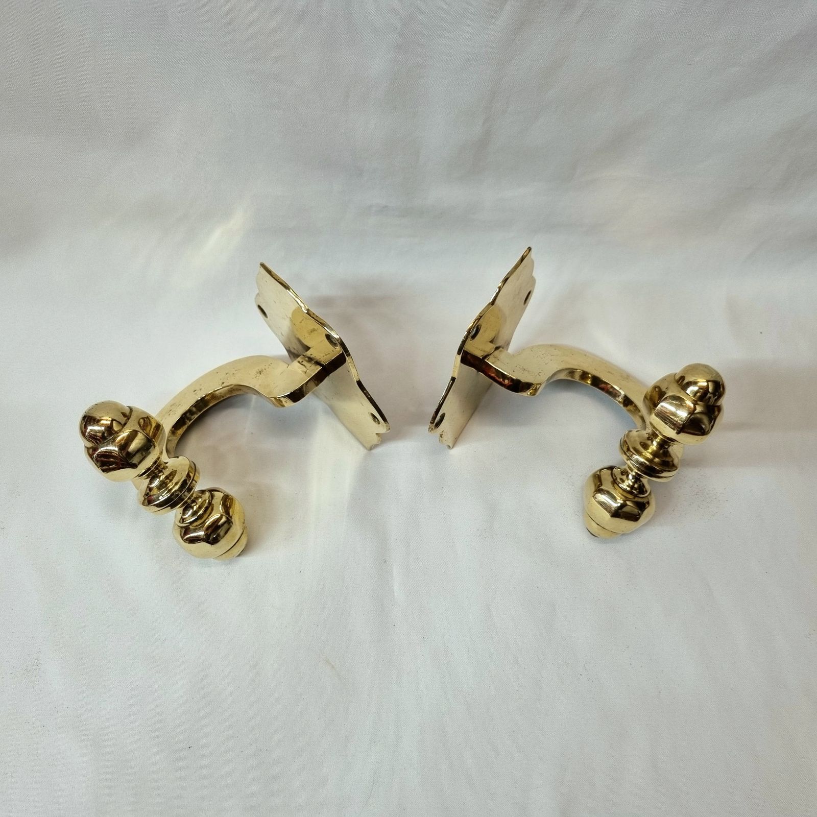 A Fine And Rare Pair Of 19th Century Heavy Brass Chimney Piece Opposing Jamb Hooks For Supporting Fireirons Either Side Of A Fireplace. photo for sale