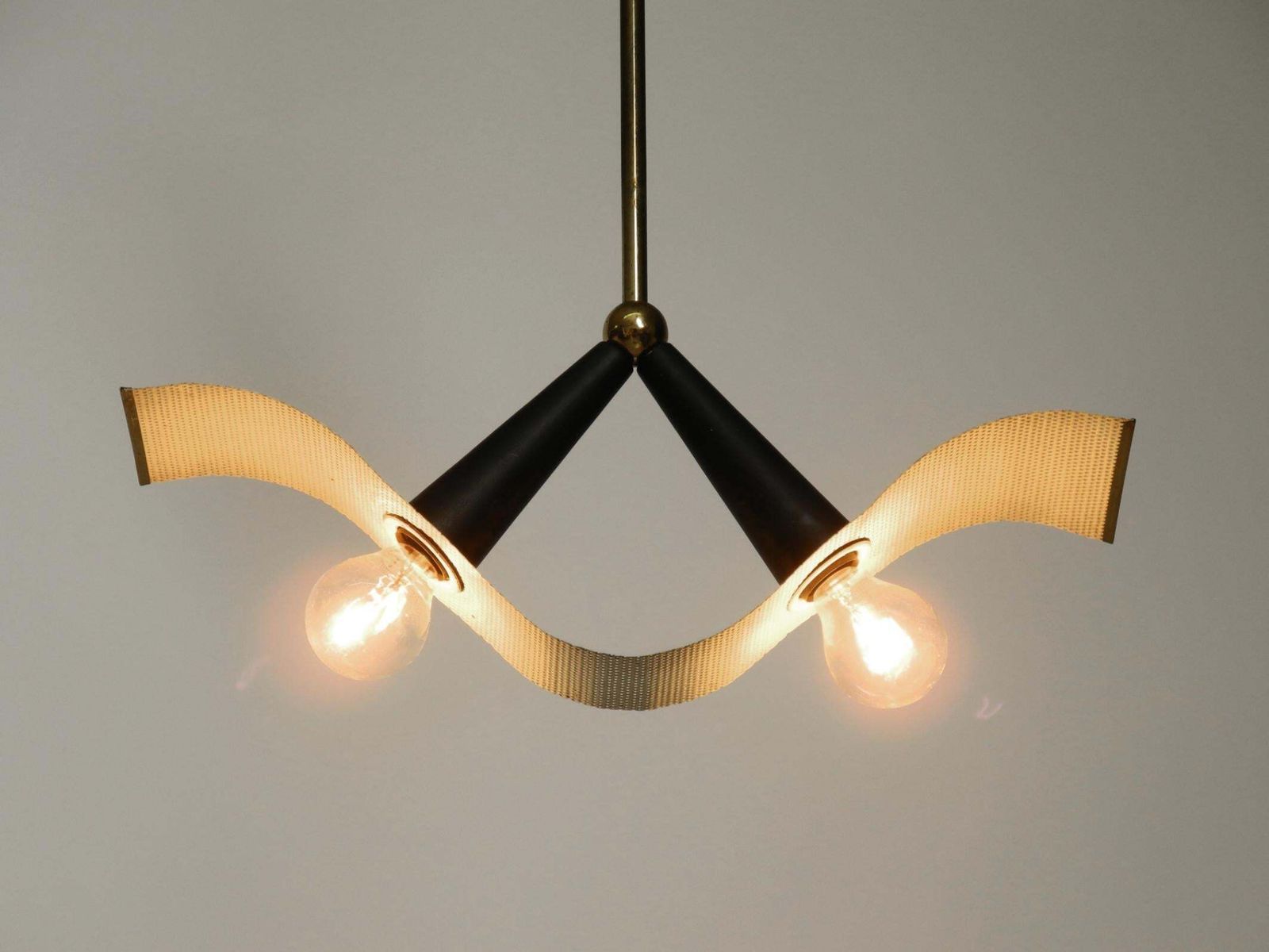 Mid Century Brass Ceiling Cone Lamp With A Curved Perforated Sheet Lampshade photo vinterior