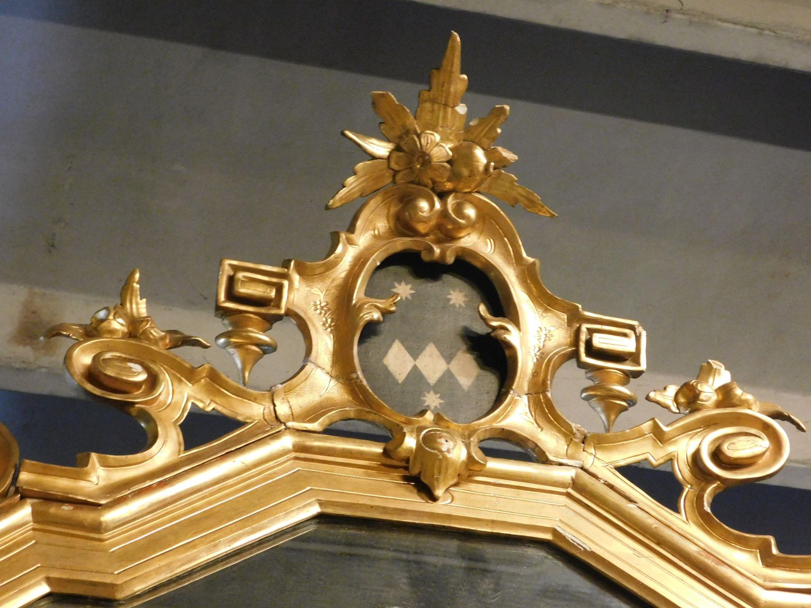 3006.0 Large Gilded Wooden Mirror With Carved Top Centered By A Coat Of Arms, Italy photo