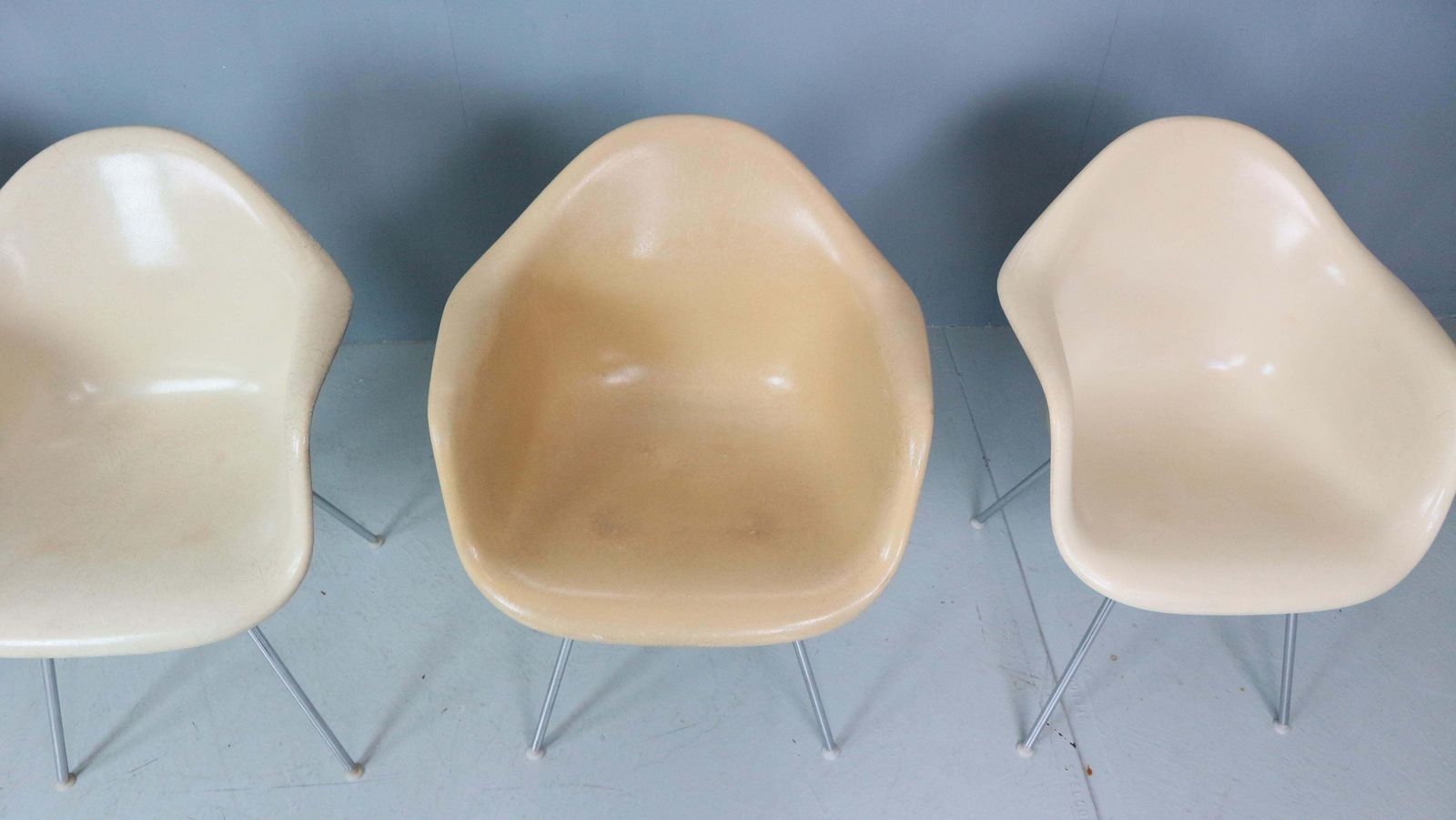 photo furniture Charles & Ray Eames Set Of 4 Off White "H Base" Chairs For Herman Miller, 1960