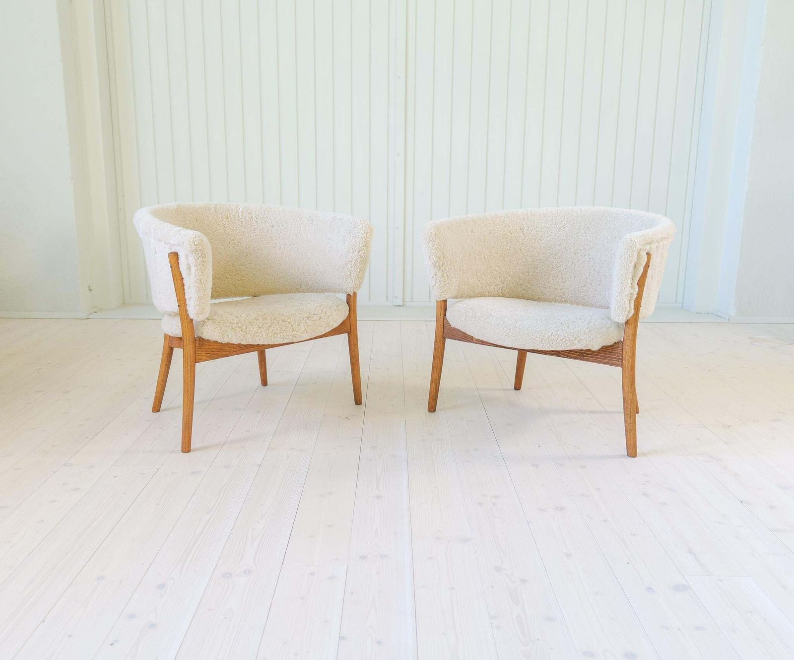 photo for sale Mid Century Lounge Chairs In Sheepskin/Shearling And Stained Wood, Sweden, 1962