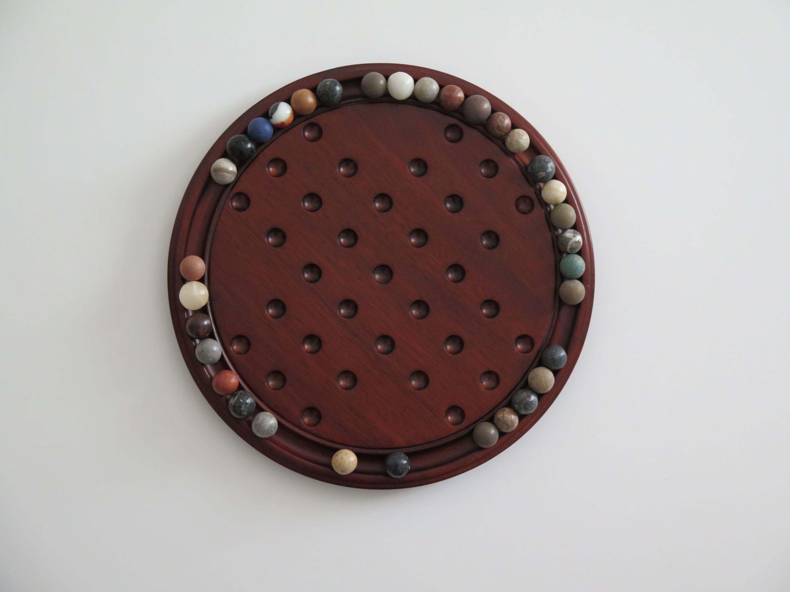 Marble Solitaire Game 10 Inch Hardwood Board 35 Mixed Stone Marbles, Circa 1945 photo vinterior