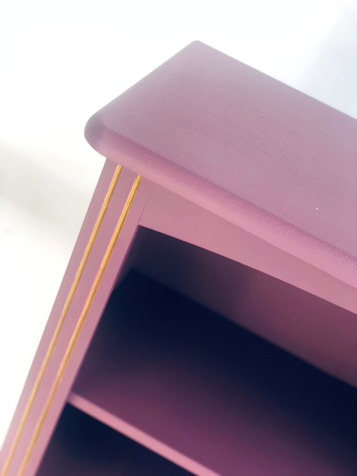 Painted Purple Bookshelf With Gold Trim Detail photo for sale