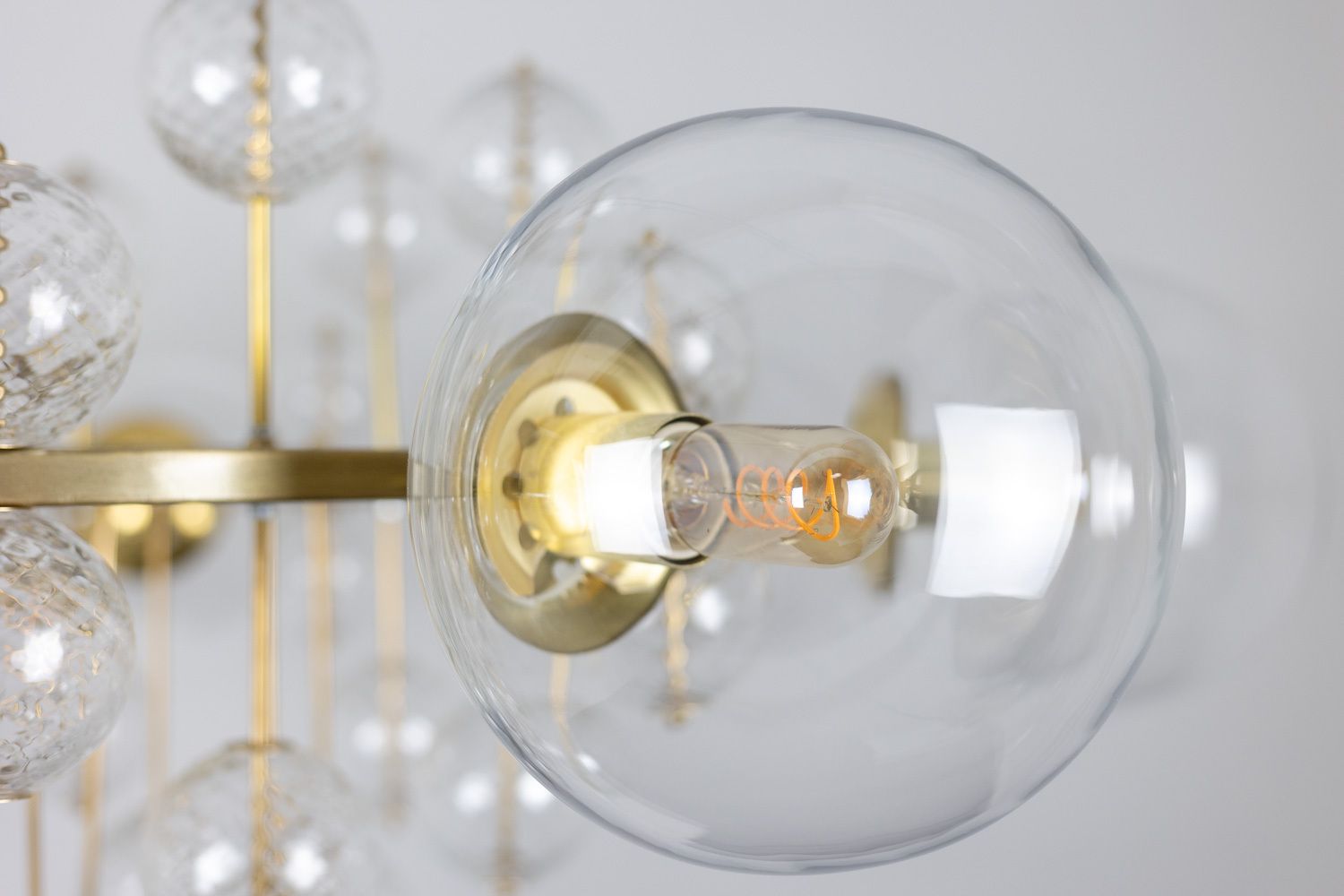 Large Chandelier In Gilded Brass And Decorative Balls. 1970s. photo Lighting
