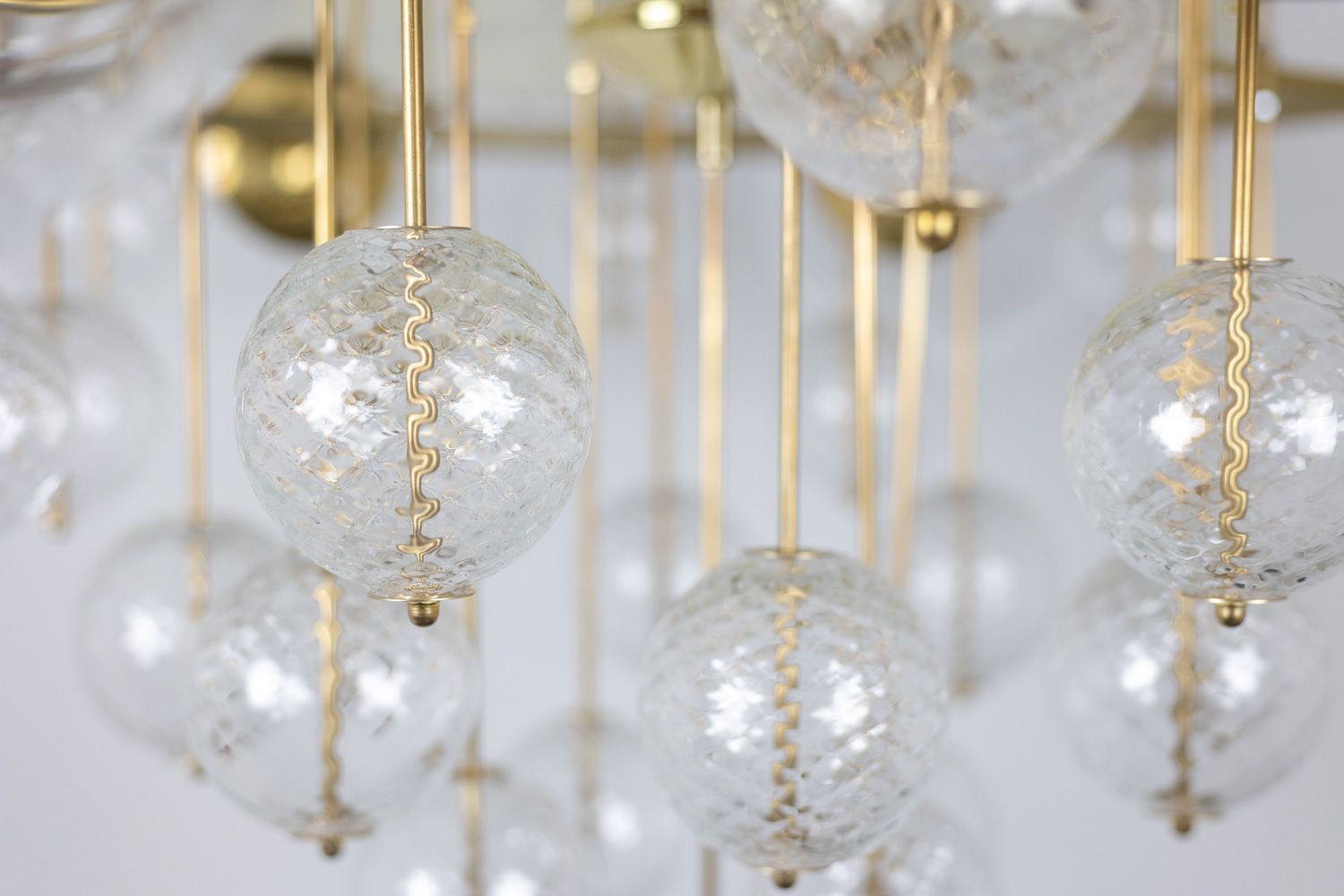 Large Chandelier In Gilded Brass And Decorative Balls. 1970s. photo furniture