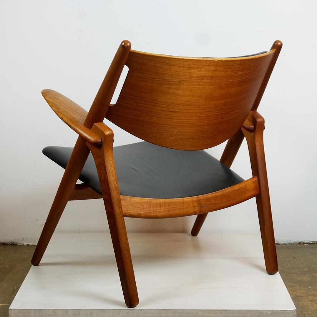 photo furniture Scandinavian Teak And Black Leather Ch28 Chair By Hans Wegner For Carl Hansen