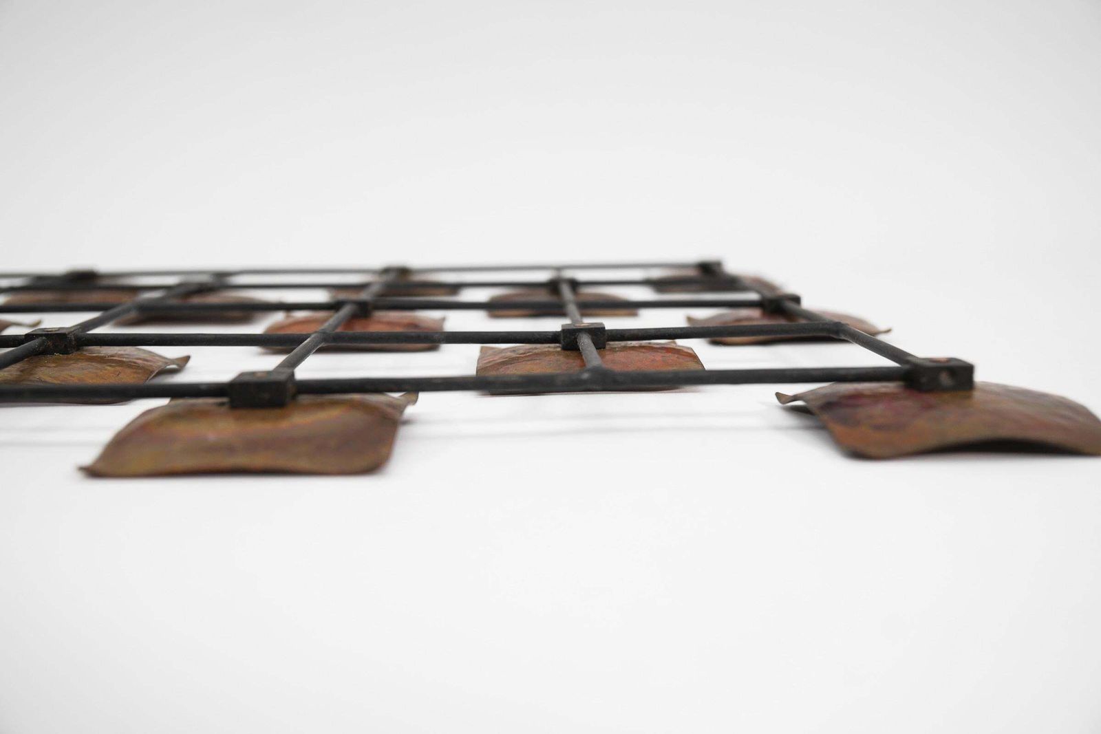 photo for sale Hang Finished Artist Mural Made Of Copper Elements On A Metal Lattice Frame