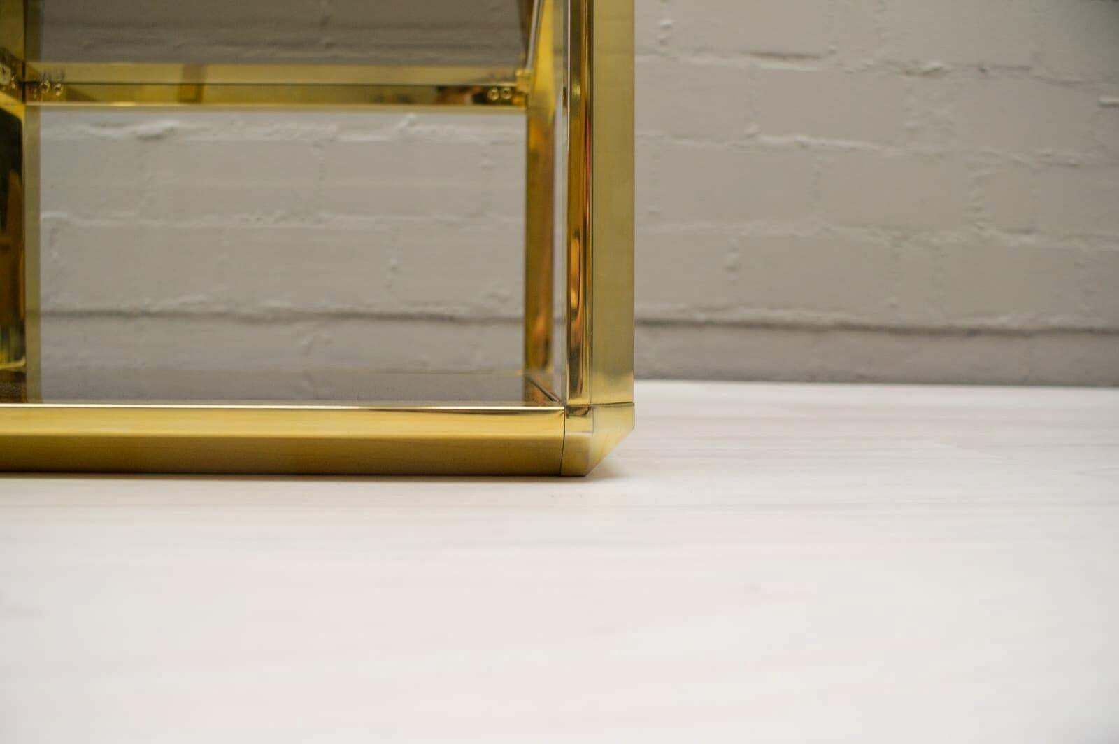 Furniture Hollywood Regency Pyramid Shelf In Gold And Smoked Glass, France 1960s photo
