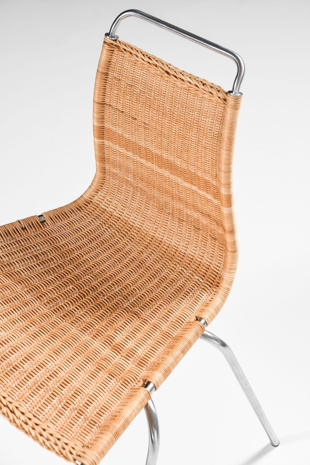 photo furniture Set Of 8 Dining Chairs In Chromed Steel And Woven Cane By Poul Kjærholm, 1950's