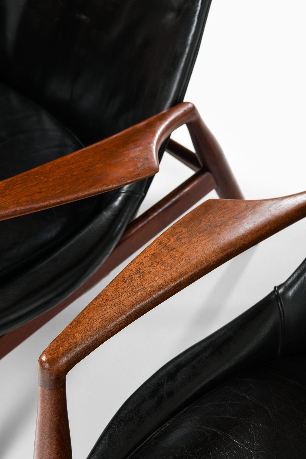 photo furniture Pair Of Easy Chairs In Teak And Original Black Leather By Ib Kofod Larsen