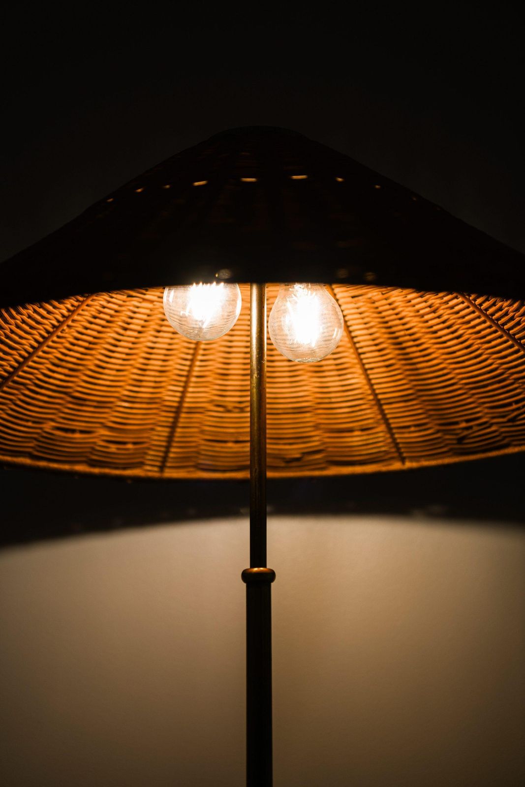 photo for sale Height Adjustable Floor Lamp In Brass, Woven Cane And Rattan Shade, 1940's