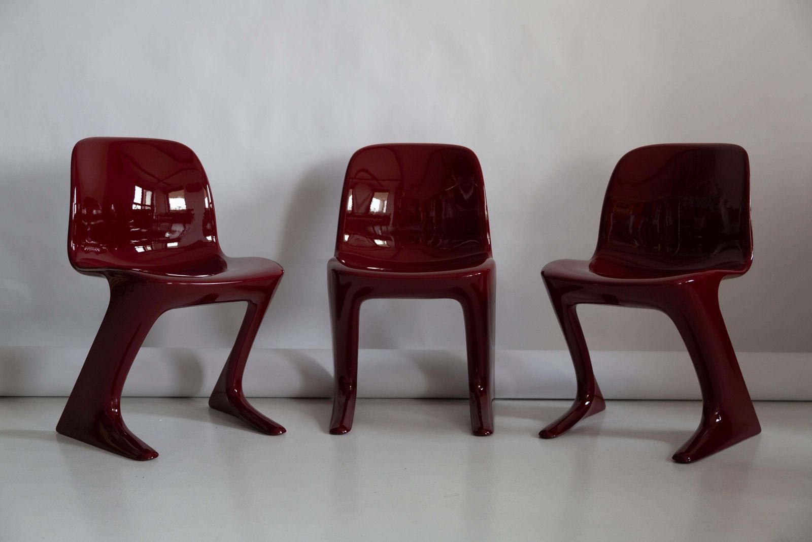 Pair Of Dark Red Wine Kangaroo Chairs Designed By Ernst Moeckl, Germany, 1968 photo for sale
