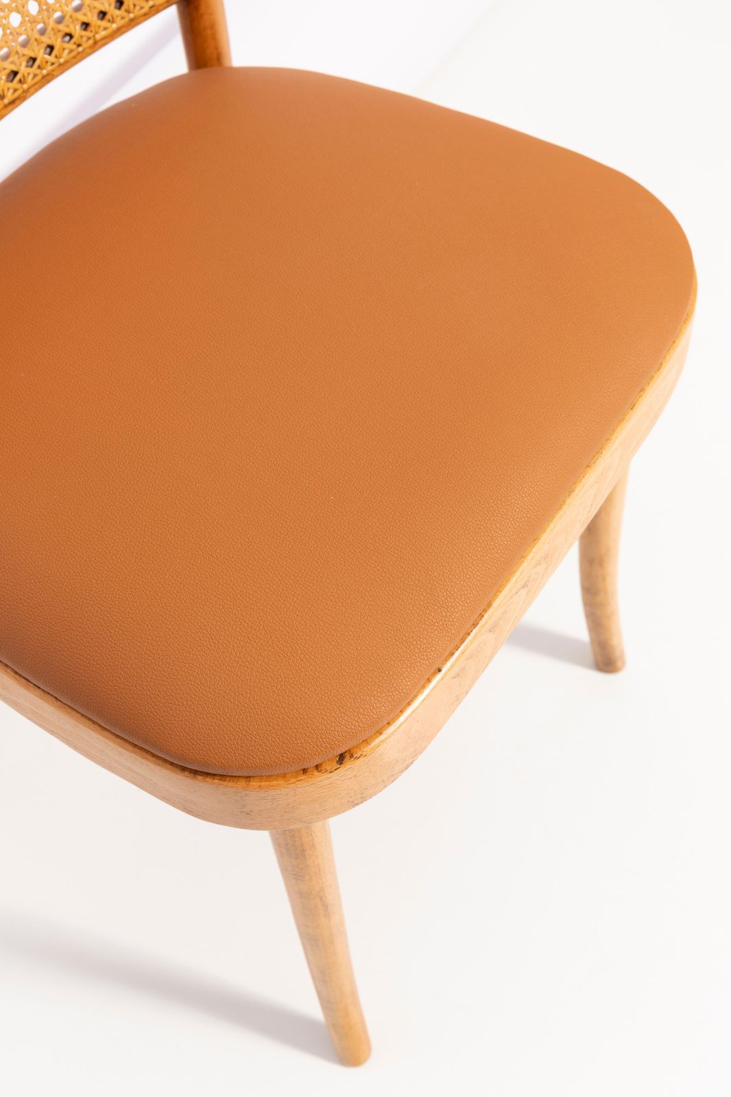 photo furniture Set Of Four Mid Century Camel Faux Leather Thonet Wood Rattan Chairs, 1960s